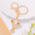 Golden alloy Ruyi key chain with cat eye stone and rhinestones on elegant ceramic plate - Cat Eye Stone Key Style (Style 1)
