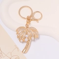 Golden coconut tree keychain with rhinestones and pearls on a white tray with lobster clasp - Gold Coconut Tree With White Rhinestone