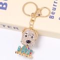 Close-up of cute dog keychain with white and blue rhinestones and gold plating - Blue And White Dog (Color 1)