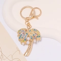 Detailed palm tree keychain featuring colorful rhinestones and white pearls on gold metal - Gold Palm Tree With Multicolored Rhinestone