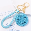 Blue rhinestone smiley face keychain with light blue woven leather strap and gold metal hardware - Blue Smiley Face With Leather Strap