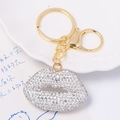 Close-up of golden lip-shaped keychain featuring sparkling rhinestones and lobster clasp - Multicolor/Clear Lips (No Rope)