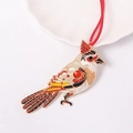 Macro shot of red rhinestone bird pendant with enamel details and golden metal frame - Artistic Cardinal Style(Color 3)