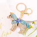 Detailed view of horse keychain with blue rhinestones and gold finish on ceramic background - Blue (Color 2)