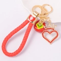 Roter Persimone-Herz Schlüsselanhänger mit gewebtem Seil, Strass und Gold-Elementen - Persimone Rot mit Seil