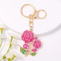Exquisito llavero de rosa de cristal rosa con diamantes de imitación y cierre dorado - Rosa