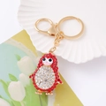 Sparkling penguin keychain with red and white rhinestones on a gold-plated metal link - Red