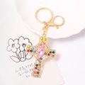 Close-up of golden cross keychain with colorful rhinestones on decorative card - Multi-color Rhinestone (Color 2)