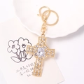 Elegant gold cross keychain with sparkling white rhinestones and a pear-shaped center crystal - White Rhinestone (Color 1)