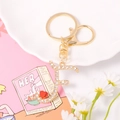 Detail of crystal letter F keychain with sparkling rhinestones and a small red heart charm - Letter F