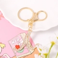 Detail of gold letter A keychain with sparkling crystals and a red heart pendant - Letter N