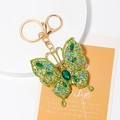 Luxury butterfly keychain with colorful green and blue crystals on a gold alloy base - Green