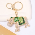 Detail of gold elephant keychain with green enamel, sparkling rhinestones and lobster clasp - Green