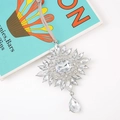 Close-up of sparkling snowflake crystal pendant with large teardrop on suede cord - Style 1 (Rectangular Main Stone Floral Design)