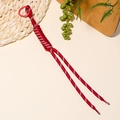 Detail of red braided cord phone strap with high-strength woven texture and ring clip - Red