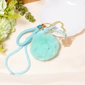 Close-up of a mint green fluffy pom-pom keychain with heart clip and rhinestone butterfly - Letter T