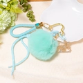Detail of light blue fluffy pom pom keychain with gold heart clasp and rhinestone charms - Letter Z