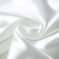 Close-up of white satin fabric with smooth silk texture and elegant draping effect - S / White