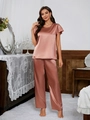 Close-up of elegant satin short-sleeve top and loose pants in mauve silk texture - S / Orange Red
