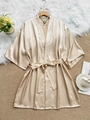 Close-up of champagne silk satin robe with kimono sleeves and elegant pearl necklace detail - S / Champagne