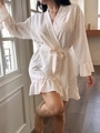 Detail view of cotton gauze robe featuring pink bow prints and delicate ruffled hemline - S / Small Floral Print
