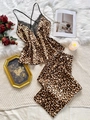 Detailed view of leopard print pajamas with black lace trim and silk satin fabric texture - S / Leopard Print
