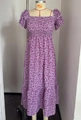 Purple floral dress with smocked bodice and ruffled short sleeves on mannequin - S / Purple