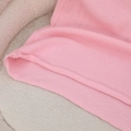 Women's pink knit sweater vest featuring a sleeveless V-neck design and smooth texture - Pink Details