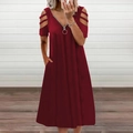 Detail of burgundy V-neck dress with silver zipper, metal ring puller and cold shoulder design - S / Bottoms / Burgundy
