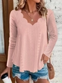 Detail of scalloped V-neckline and intricate eyelet pattern on pink long sleeve top - Pink
