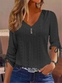 Elegante blusa negra con cuello en V, patrón geométrico calado y lazos en los puños - S / Tops / Negro