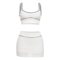Weißes sportliches Set aus Crop-Top und Minirock mit schwarzer Paspelierung für Damen - M / Weiß