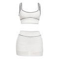 Completo sportivo due pezzi da donna bianco con bordi neri, top corto e minigonna - S / Bianco
