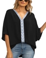 Close-up of V-neckline featuring blue geometric pattern on black chiffon batwing sleeve blouse - S / Black