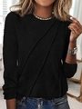 Detail of a women's black long sleeve top with stylish diagonal pleated stitching details - S / Black