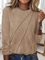 Detail of khaki brown knit top with round neck and unique diagonal seam stitching - Coffee