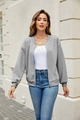 Detail of light grey zip-up knit cardigan with cable pattern and ribbed texture - Gray