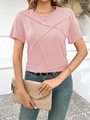 Detail of pink short-sleeve T-shirt with decorative X-shaped cross-stitching on the front - Pink