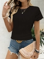 Detailed close-up of hollow out scalloped short sleeves on black diamond knit T-shirt - S / Black