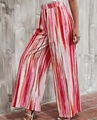 Detail view of high-waist wide-leg pants with colorful gradient vertical stripes and pleats - S / Red