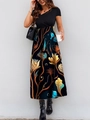 Detail of the elegant patchwork dress featuring a V-neck bodice and floral print skirt - Peacock Flower