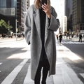 Close-up of a grey oversized wool coat with broad lapels and double-button closure - S / Tops / Gray