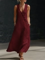 Detail of burgundy V-neck linen maxi dress featuring side button accents and hidden pockets - Burgundy