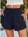 Detail of high-waisted navy paperbag shorts with drawstring and cuffed hem edges - S / Navy Blue