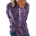 Detail view of purple oversized long sleeve sweatshirt with black star print and side slits - S / Purple