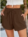 Detail of dark brown high-waisted paperbag shorts with adjustable drawstring and side pockets - Coffee