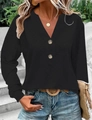 Close-up of women's black V-neck long sleeve top with textured waffle knit and wooden buttons - S / Black