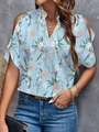 Detail view of light blue cold-shoulder blouse with pink floral prints and V-neckline - Color 3