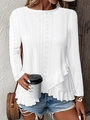 Close-up of white long sleeve top featuring eyelet embroidery and ruffle hem detail - S / Tops / White