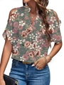Detailed view of the V-neck and cold shoulder floral print blouse on a model - S / Rainbow